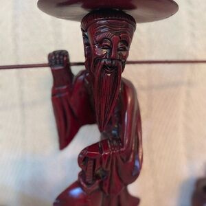 Antique hand-carved Oriental man with buckets